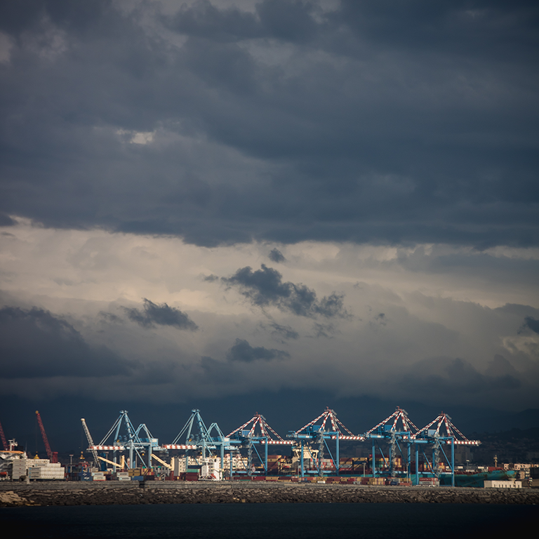 view-cranes-harbor-against-sky